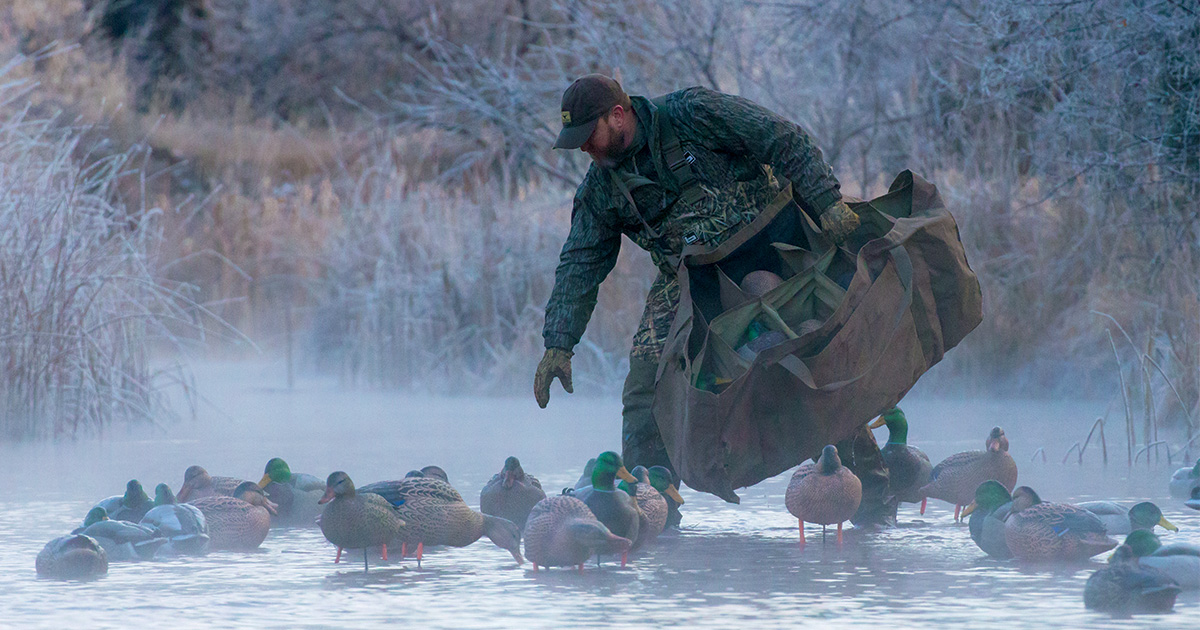 Waterfowl hunter picking up decoy spread. By DougSteinke.com_Transportation.jpg